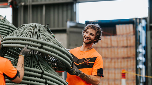container crew loading a shipping container